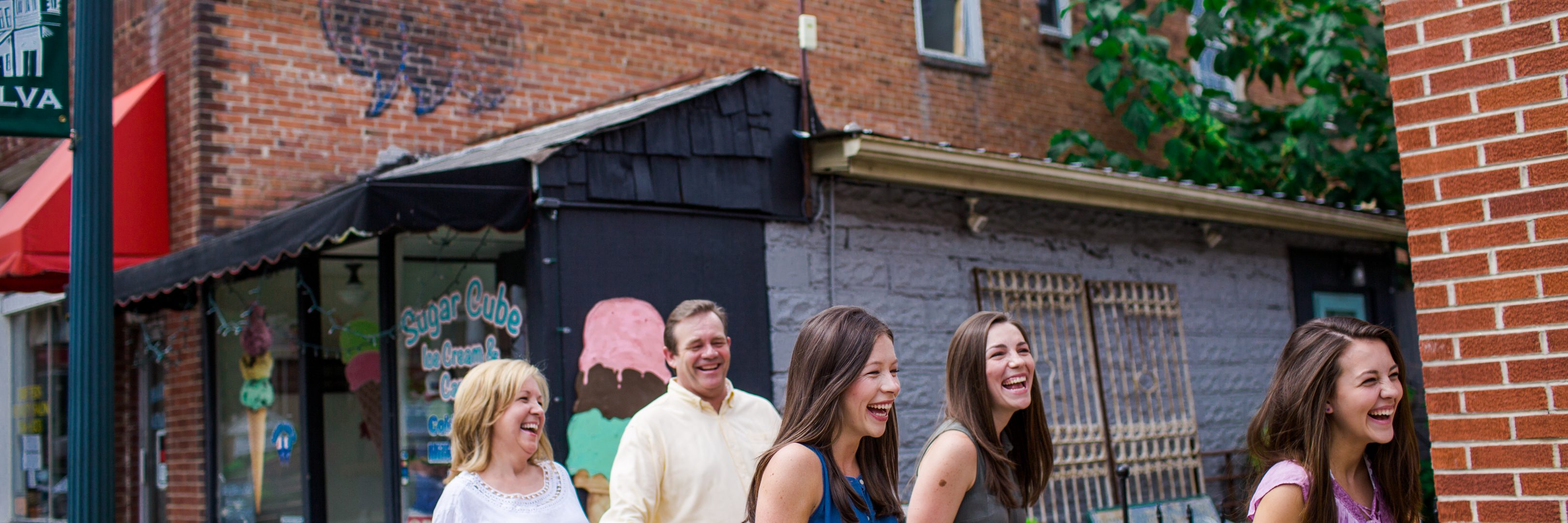 family laughing together and walking through Jackson County